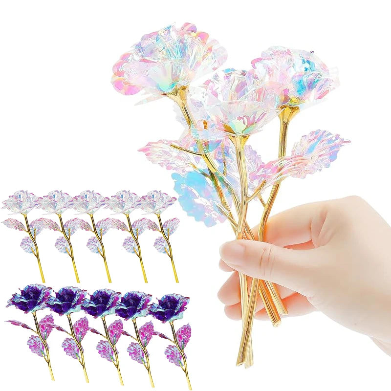Hand holding a bouquet of iridescent crystal flowers with pink and blue petals.