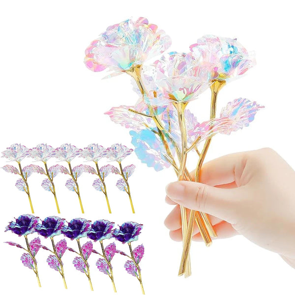 Hand holding a bouquet of iridescent crystal flowers with pink and blue petals.