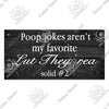 A dark wooden sign with white text that reads Poop jokes aren't my favorite Lut They're solid #2