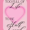 A pink art print featuring elegant script text that reads Too Full of Life to be Half Loved on a soft pink background.