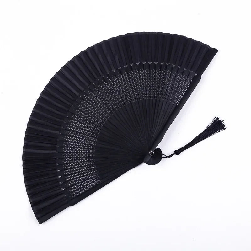 A black traditional Chinese folding fan with a pleated design.