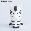 A white and gray tiger-themed decorative object with large ears and facial features.