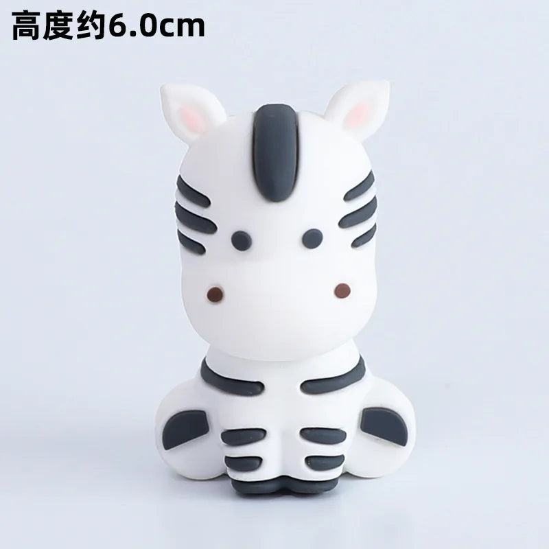 A white and gray tiger-themed decorative object with large ears and facial features.