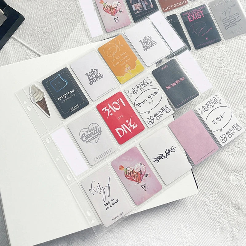 A collection of square, colorful stickers and labels arranged on a white grid binder sheet.