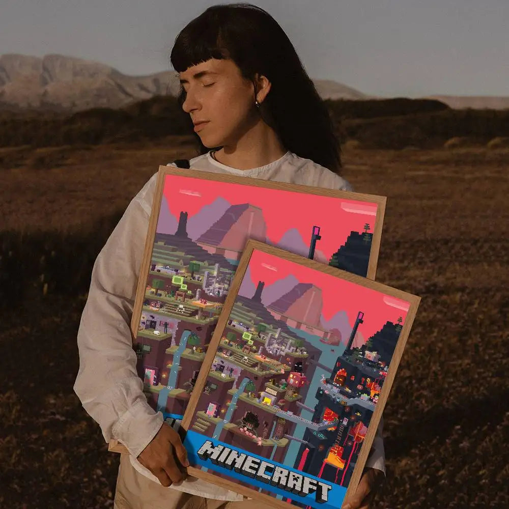 A person holds a framed print of a Minecraft landscape featuring colorful terrain and structures.
