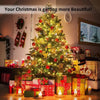 A brightly lit Christmas tree decorated with red ornaments and wrapped gifts in a home setting.