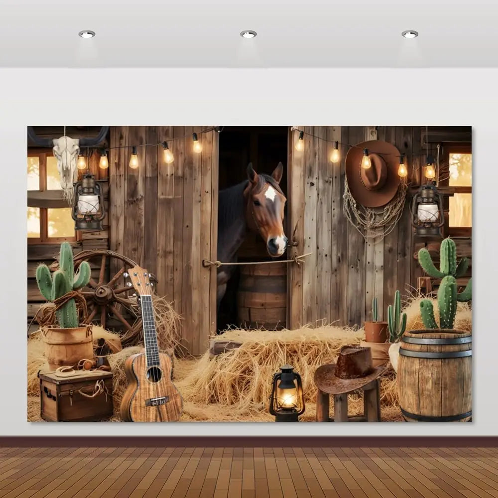 A rustic western backdrop featuring a wooden barn door, a horse, and various rustic props like cacti and lanterns.