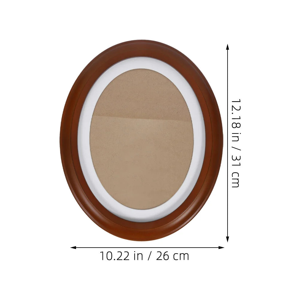 An elegant oval wooden wall photo frame with a brown finish and white border.