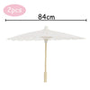 A white decorative paper parasol umbrella with a 84cm span and a light wooden pole.