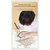 A child is excavating a fossil from a block of plaster using a brush, demonstrating archaeological exploration.