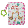 A pink and white striped photo book featuring illustrations of giraffes and a baby elephant.