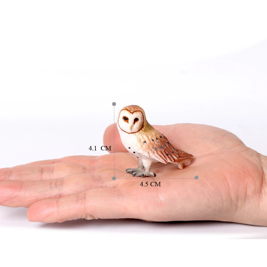 A small figurine of an owl resting on the palm of a hand, showing its size relative to the skin.