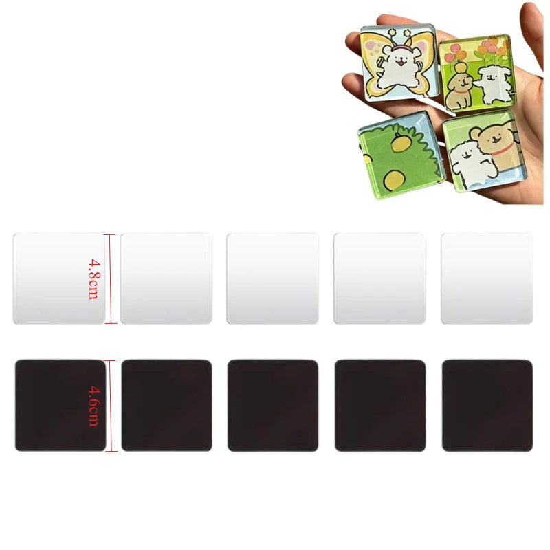 A hand holds several colorful acrylic fridge magnets featuring cute animal designs.