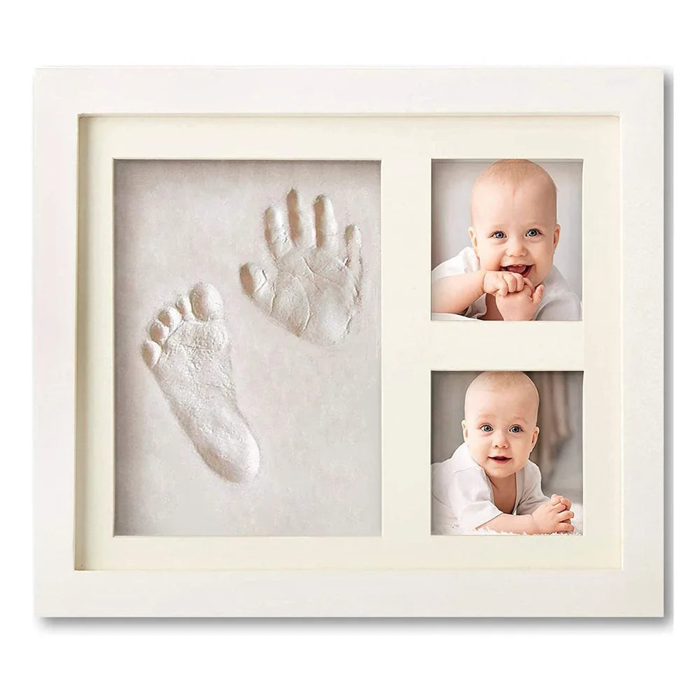 A white photo frame displaying three baby handprints and a footprint on a light background.