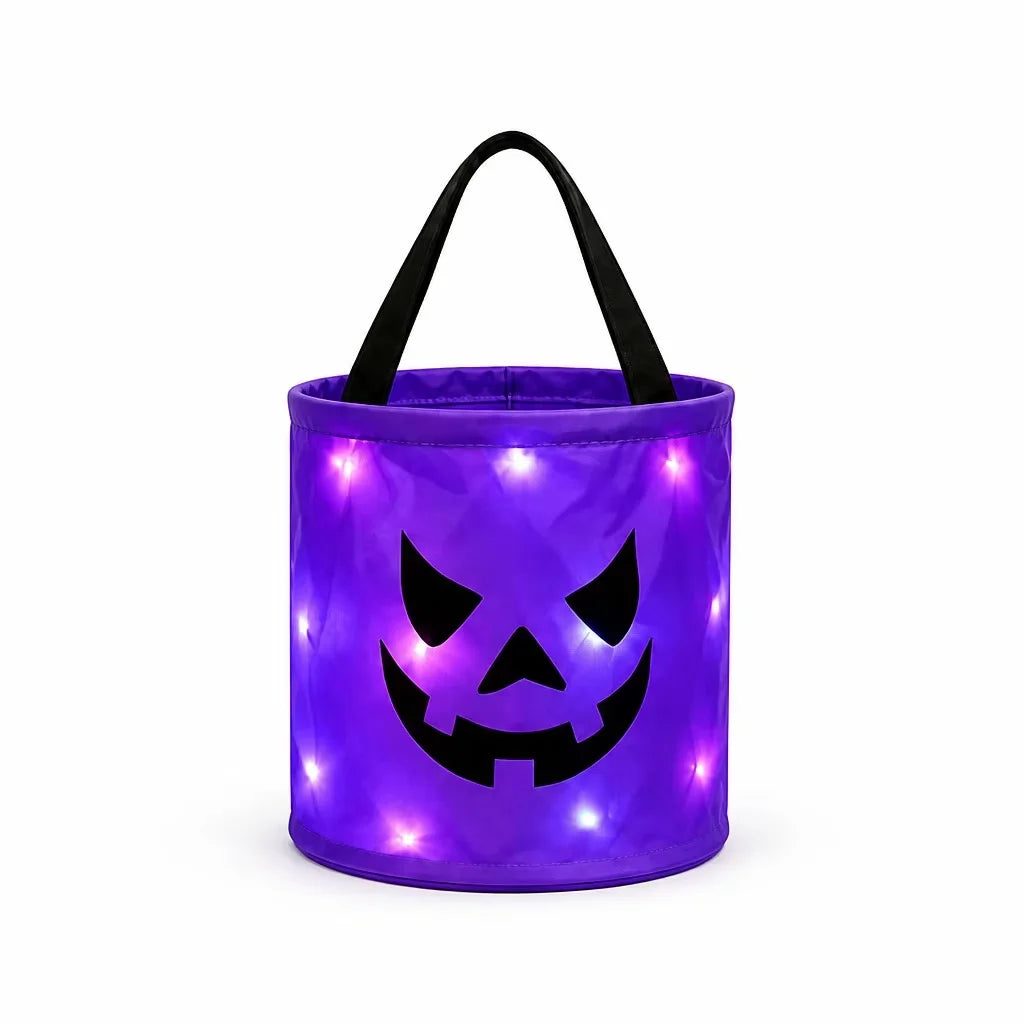 A purple glowing pumpkin candy bucket with a black LED handle.