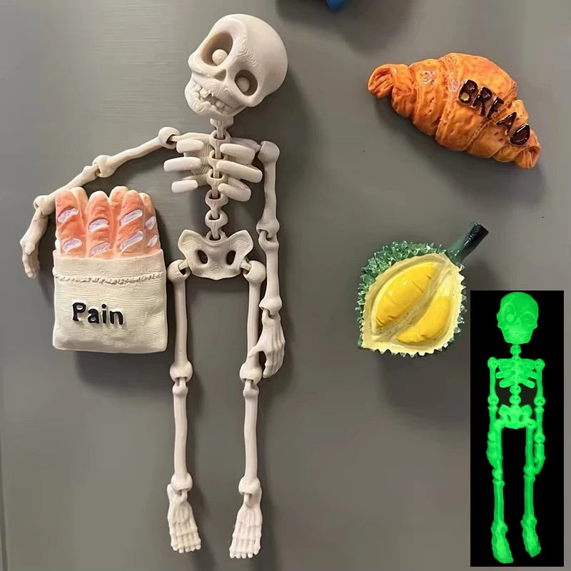 A set of magnetic poseable skull fridge magnets showing a skeleton, a face, and a bread loaf.