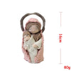 Handcrafted Virgin Mary crochet doll with a pink garment and brown hair