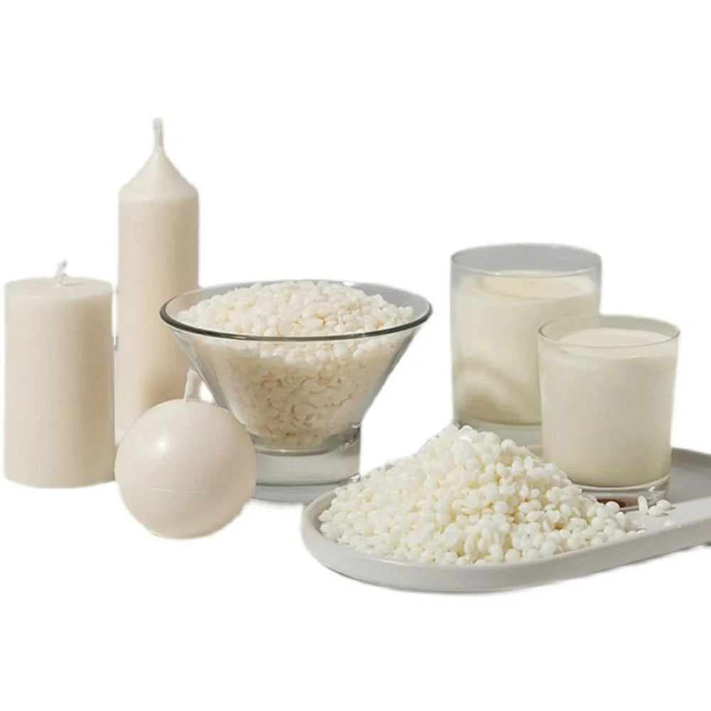 Natural soy wax flakes displayed with candles and glass jars for DIY candle making