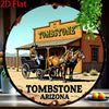 Vintage western sign featuring a wooden tombstone building and a horse-drawn wagon in an Arizona setting.