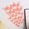 A set of pink 3D hollow butterfly wall decals arranged in a decorative pattern.