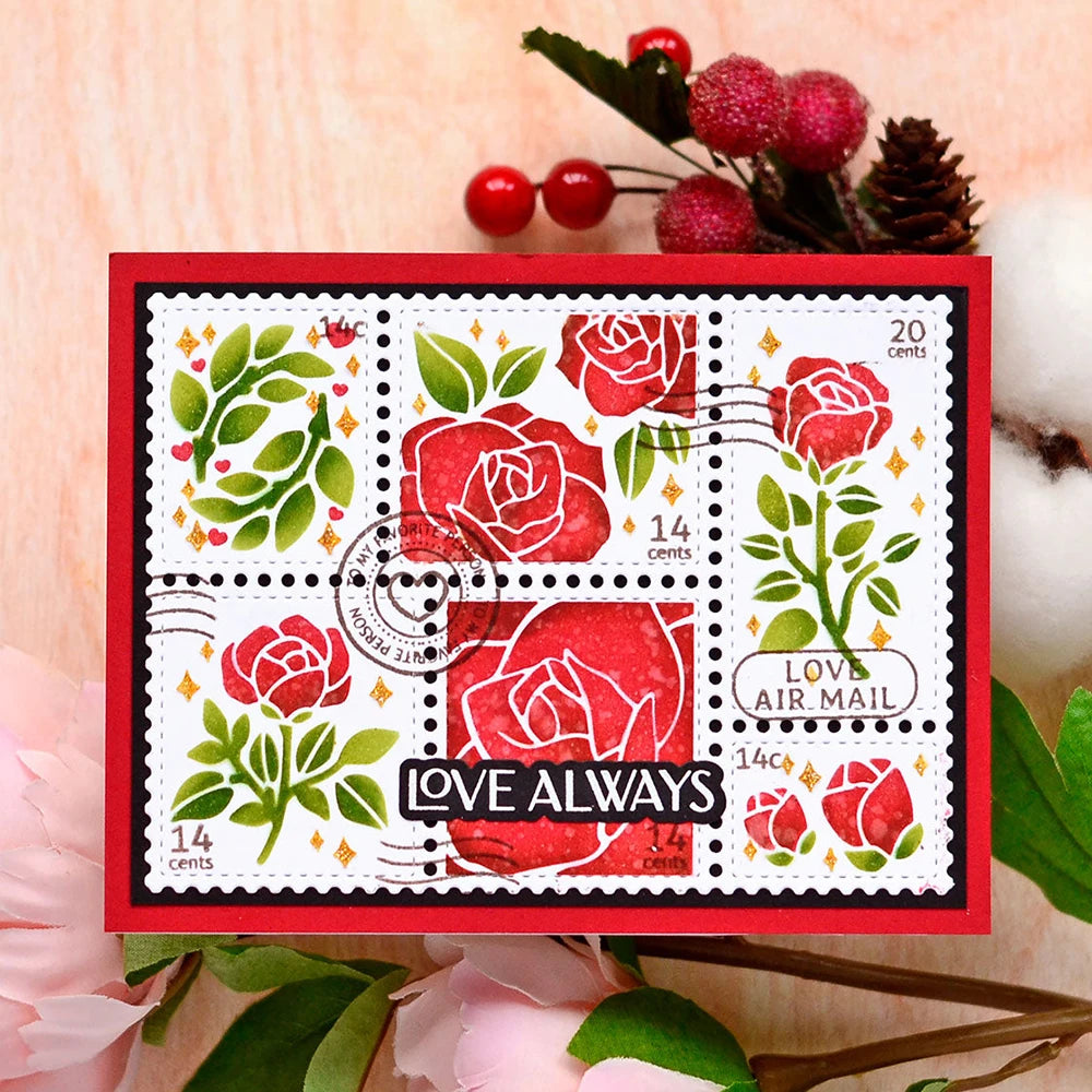 A red postage stamp featuring a red rose design and the text LOVE ALWAYS for a DIY scrapbooking set.