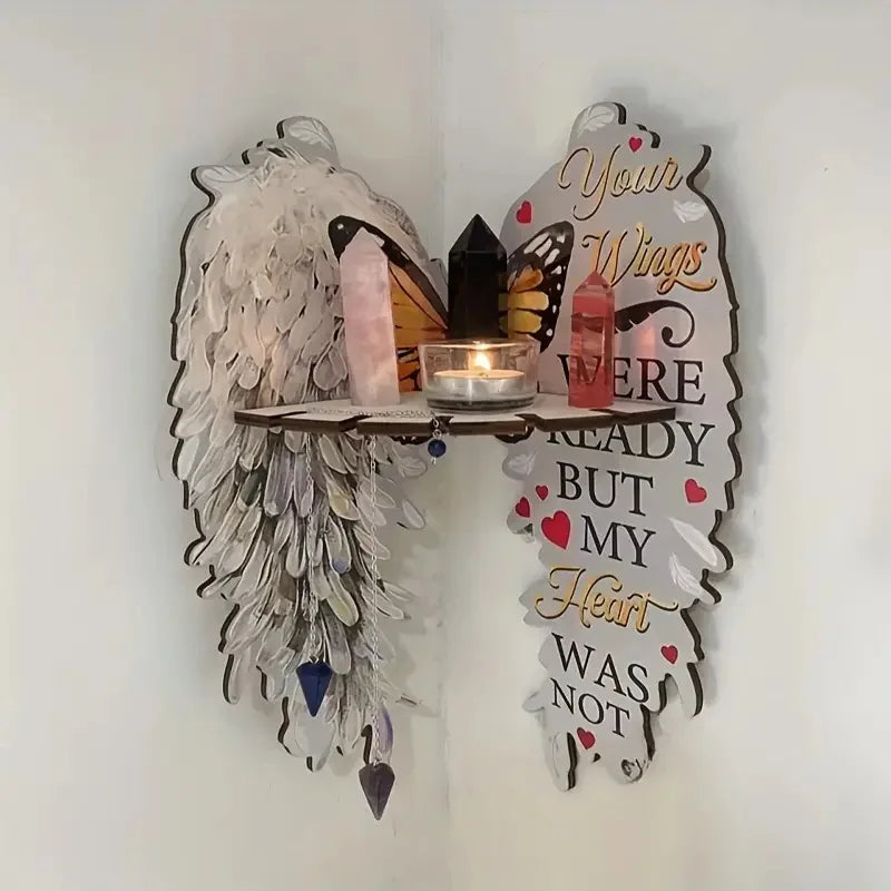 Boho wood angel wing wall shelf displaying crystals and a candle.