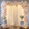 Elegant white wedding tulle backdrop decorated with light pink and white balloons and string lights