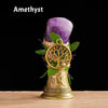 Amethyst crystal mounted on a golden Tree of Life chime for meditation and decor