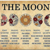 A metal wall art sign showing the eight phases of the moon with corresponding spiritual concepts and actions.