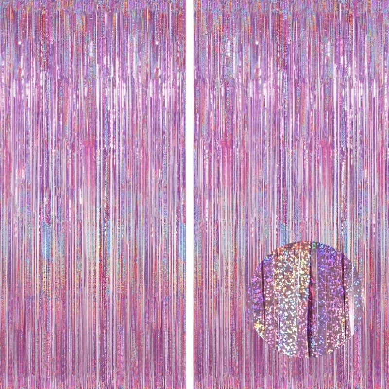 Vertical backdrop of shimmering metallic foil tinsel fringe in shades of pink and purple.