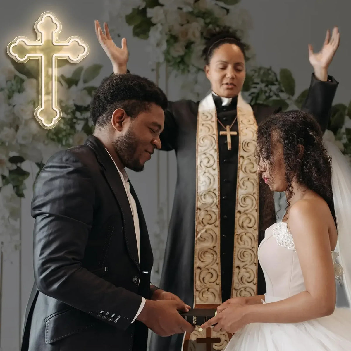 A couple is shown in a wedding-like setting with a glowing neon cross sign.