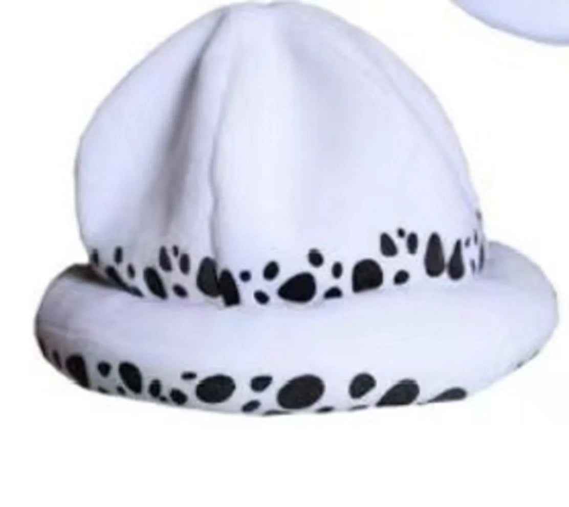 White knit cap for a plush toy featuring black spotted pattern