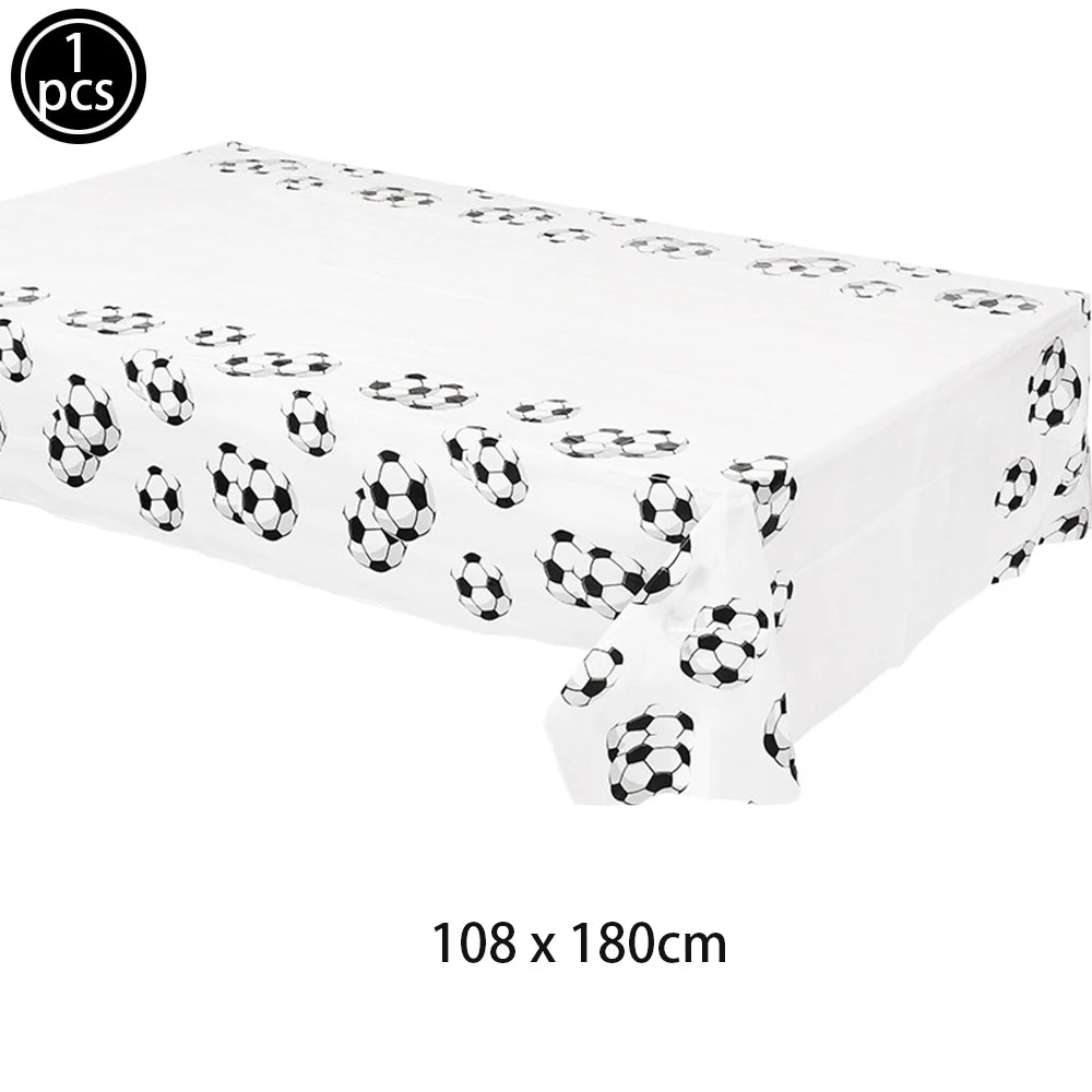 White rectangular cake topper set decorated with black and white soccer ball patterns
