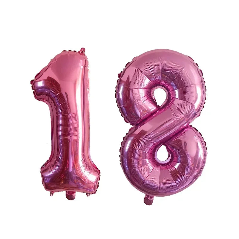 Two pink helium foil number balloons shaped like 1 and 8