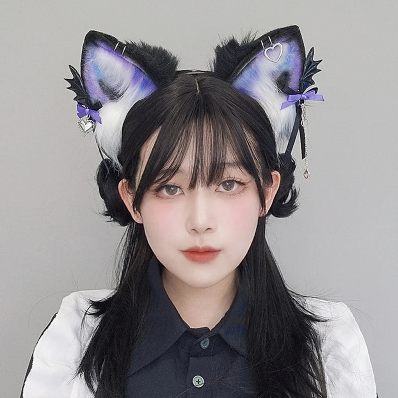A close-up photo of a woman wearing a black and white shirt with large, fluffy fox ears headband featuring purple accents.