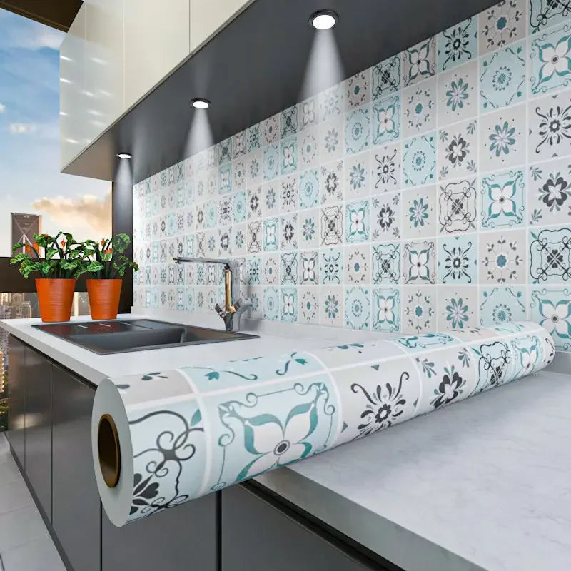A kitchen wall featuring a patterned tile backsplash and a rolled waterproof oil-proof kitchen wall sticker.