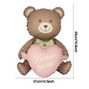 A brown bear foil balloon shaped like a heart with the words Love you on it