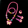 A set of pink and purple beaded jewelry including a necklace and butterfly hair clips.