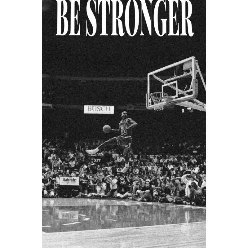 Black and white photo of a basketball player during a game, with the text BE STRONGER above the action.