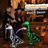 A Halloween costume featuring a luminous skeleton goose porch decor costume with a witch and a child.