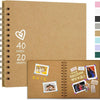 A brown spiral-bound scrapbook album with a heart design and decorative elements on the cover.