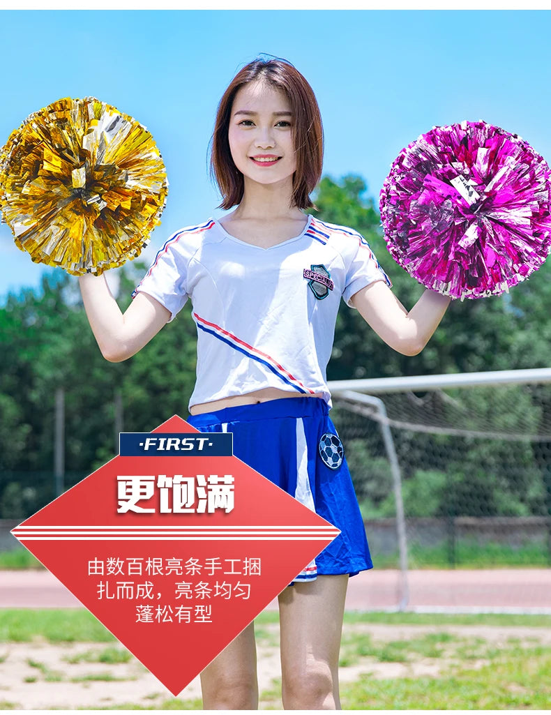 A young woman holds a bright yellow pom pom in one hand and a vibrant purple pom pom in the other.