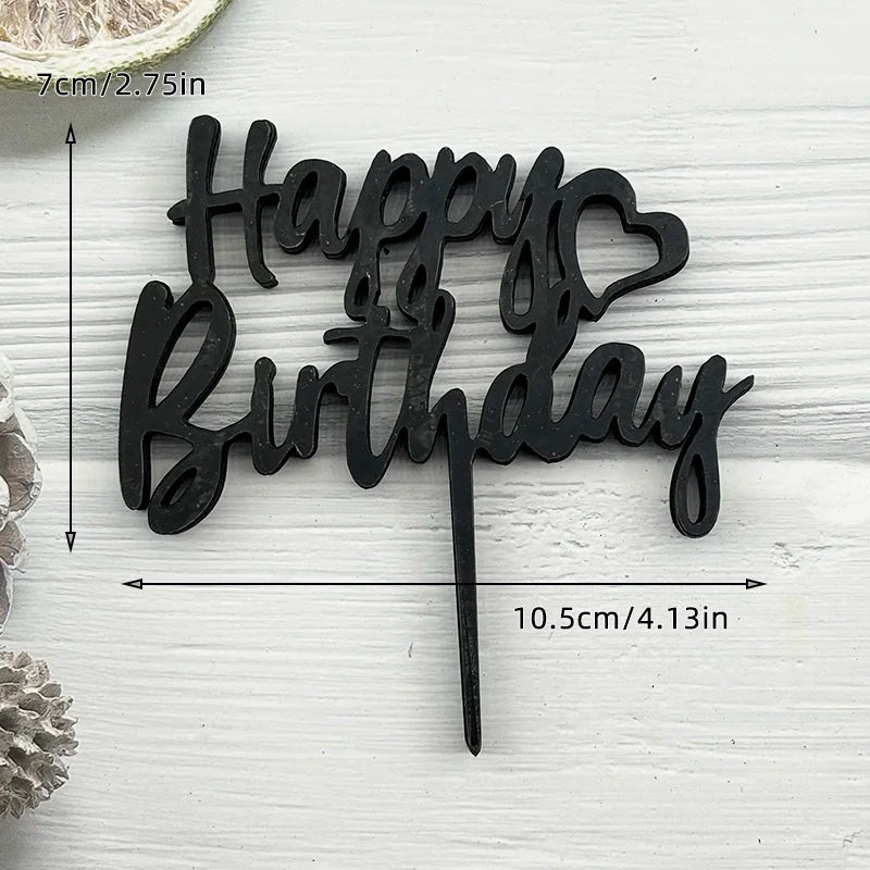 Black acrylic birthday cake topper set with the words Happy Birthday in a script font