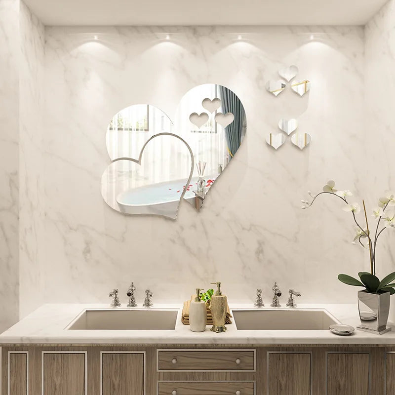 Elegant 3D acrylic heart wall art decals displayed on a white marble wall above a modern vanity.