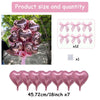 A set of pink heart-shaped foil balloons with ribbon bows, including a bouquet and individual balloons.