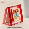 A red acrylic photo frame displaying a watercolor painting of orange flowers and text on a white background.