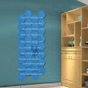 A display of 12 self-adhesive hexagon mirror wall decor stickers in various shades of blue against a teal wall.