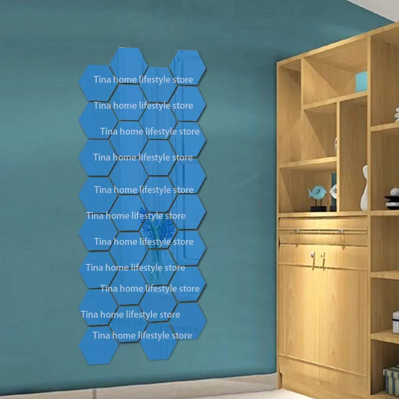 A display of 12 self-adhesive hexagon mirror wall decor stickers in various shades of blue against a teal wall.