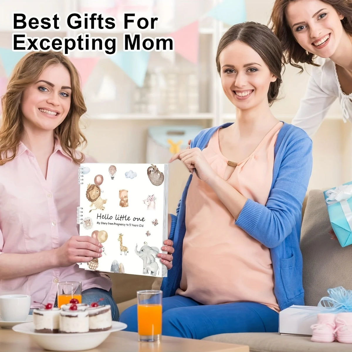 A woman holds a pregnancy and baby memory journal organizer featuring cute illustrations of a baby elephant and giraffe.