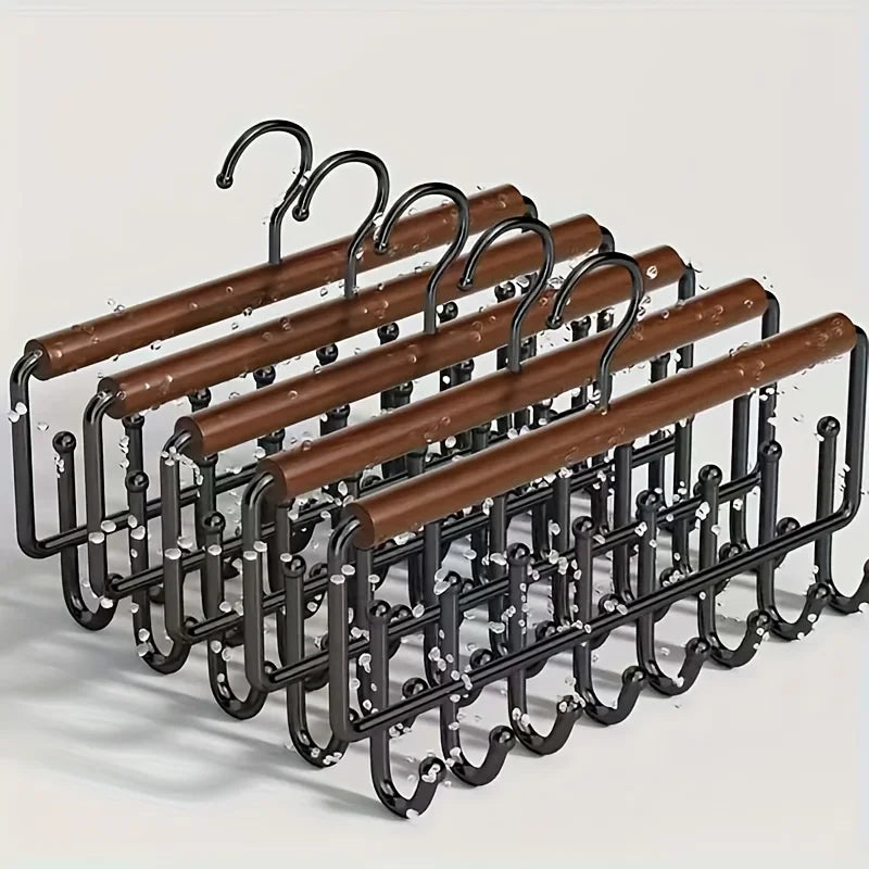 A wall-mounted metal coat rack with eight hooks and a storage box, featuring wooden bars.